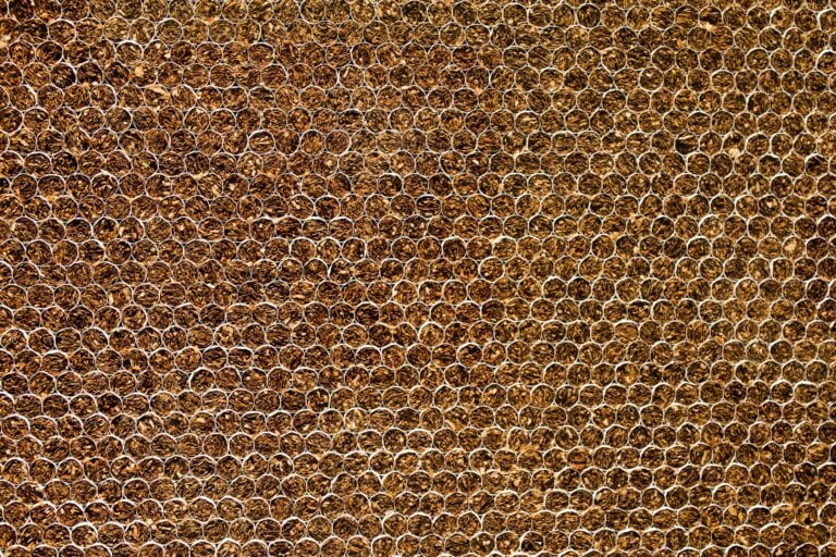 Detailed close-up of a brown textured pattern, resembling natural elements. Ideal for backgrounds.